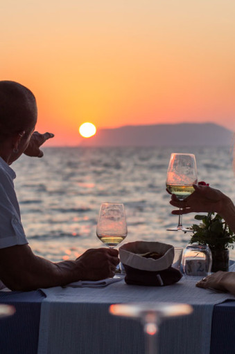couple having dinner on beach web